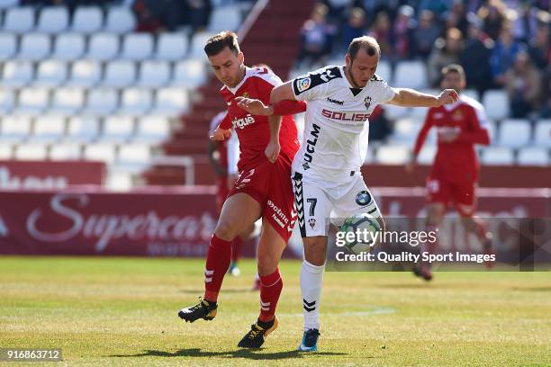 Roman Zozulia of Albacete competes for the ball with Otar Kakabadze of Nastic during the La Liga 123 match between Albacete Balompie and Nastic at...