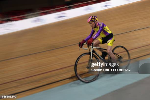 French centenarian cyclist Robert Marchand rides a 4000 meters at the Saint-Quentin-en-Yvelines track cycling on February 11, 2018. / AFP PHOTO /...