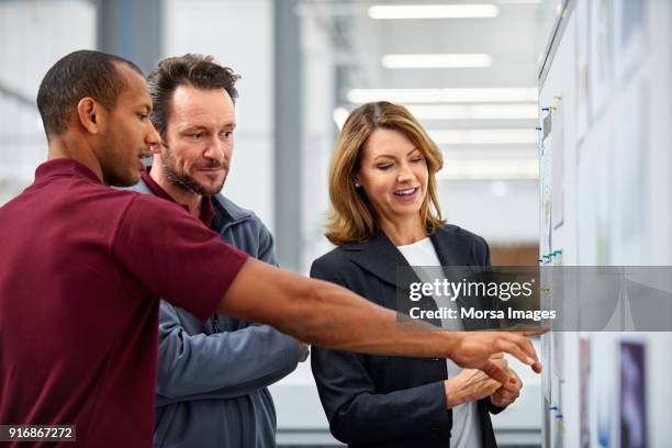 engineers and manager discussing over charts - production line worker stock pictures, royalty-free photos & images