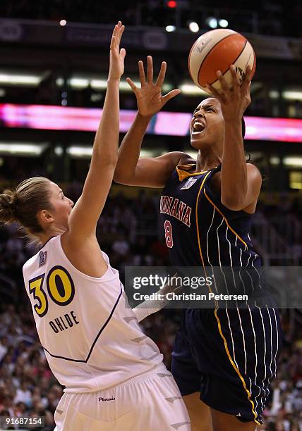 Tammy Sutton-Brown of the Indiana Fever lays up a shot over Nicole Ohlde of the Phoenix Mercury in Game Five of the 2009 WNBA Finals at US Airways...