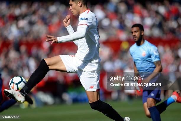 Sevilla's Argentinian midfielder Joaquin Correa kicks the ball to score a goal during the Spanish league football match between Sevilla FC and Girona...