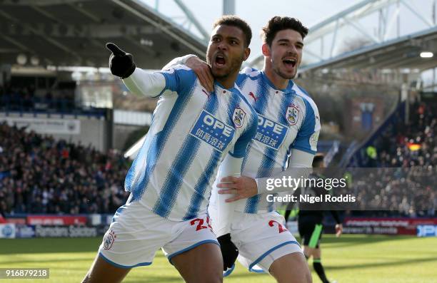 Steve Mounie of Huddersfield Town celebrates with teammate Christopher Schindler after scoring his sides second goal during the Premier League match...