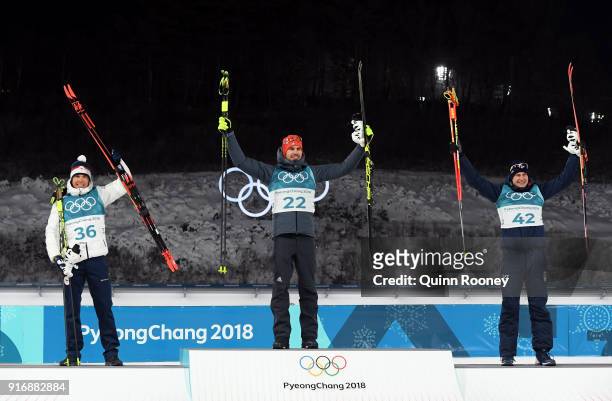 Gold medallist Arnd Peiffer of Germany poses with silver medallist Michal Krcmar of the Czech Republic and bronze medallist Dominik Windisch of Italy...