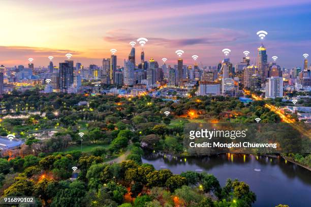 bangkok cityscape and lumpini park at bangkok thailand. network connection concept , wifi at business district - smart city stock pictures, royalty-free photos & images