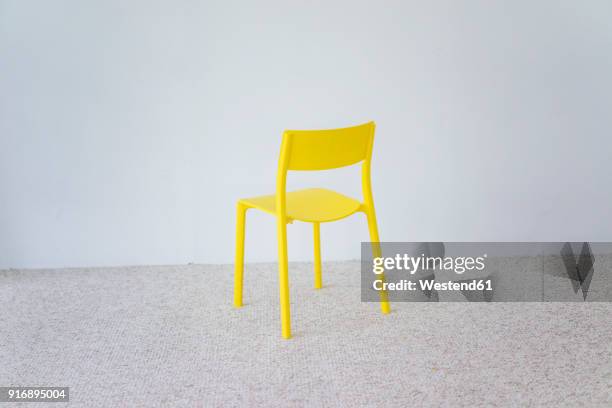 yellow chair - yellow carpet stock pictures, royalty-free photos & images