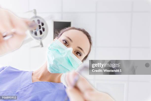 personal perspective of female dentist with mask at work - personal perspective doctor stock pictures, royalty-free photos & images