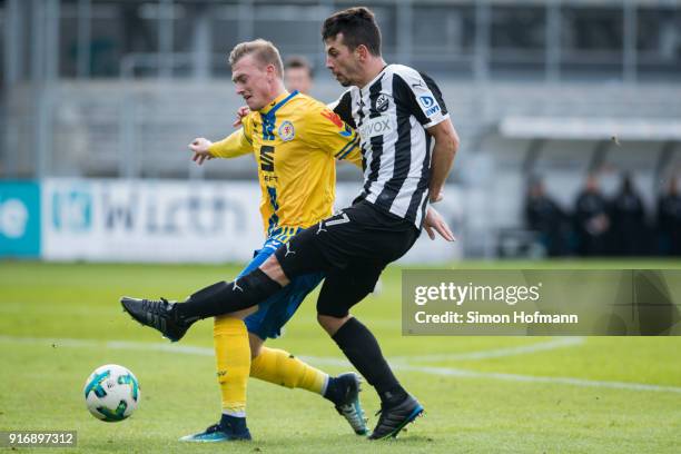 Julian-Maurice Derstrofftries to score against Georg Teigl of Braunschweig during the Second Bundesliga match between SV Sandhausen and Eintracht...