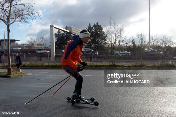 Moroccan cross-country skier Samir Azzimani trains for the Pyeongchang 2018 Winter Olympic Games near the Peripherique boulevard on February 1 in...