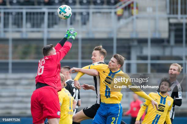 Julian-Maurice Derstroff of Sandhausen tries to score against Jasmin Fejzic and Steve Breitkreuz of Braunschweig during the Second Bundesliga match...