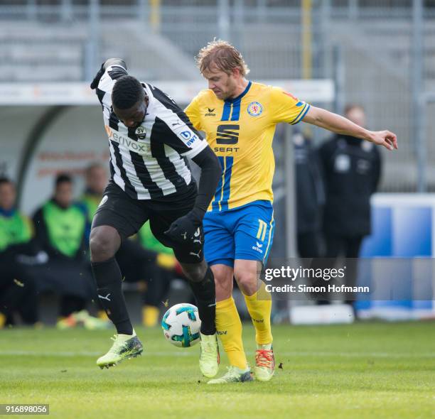 Richard Sukuta-Pasu of Sandhausen is challenged by Jan Hochscheidt of Braunschweig during the Second Bundesliga match between SV Sandhausen and...