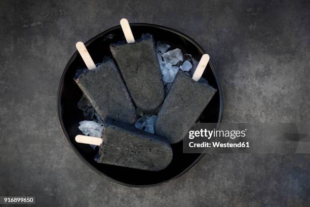homemade yoghurt icecream with activated coal - charcoal ice cream stock pictures, royalty-free photos & images