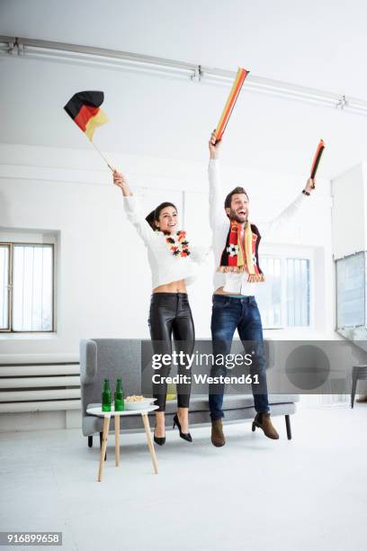 excited german football fans cheering - supporter scarf stock pictures, royalty-free photos & images