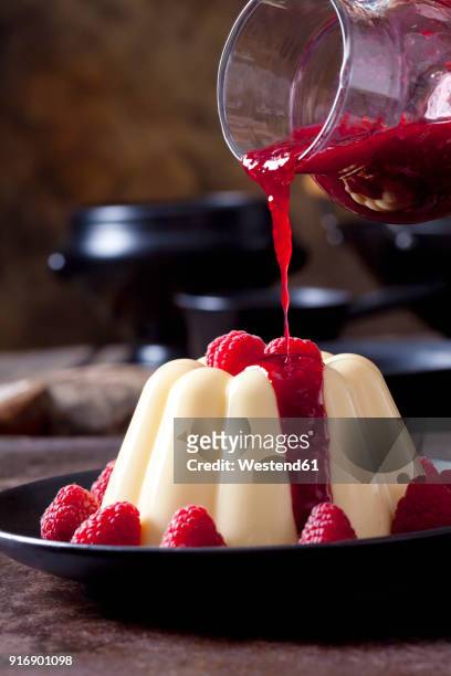 custard with raspberries and raspberry sauce on plate - raspberry coulis stock pictures, royalty-free photos & images
