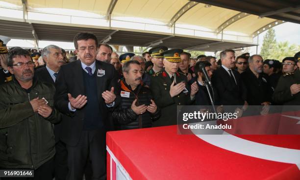 Turkish Economy Minister Nihat Zeybekci attends funeral ceremony of Staff Captain Pilot Mehmet Ilker Karaman who was martyred during Turkey's...