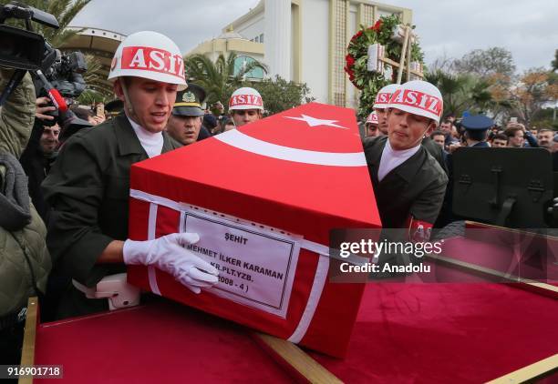 Soldiers carry the coffin of Staff Captain Pilot Mehmet Ilker Karaman who was martyred during Turkey's counter-terrorist operation in northern Syria,...