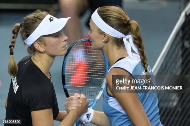 France's Kristina Mladenovic and Belgium's Elise Mertens kiss after Mladenovic won their Tennis Fed Cup world group first round match between France...