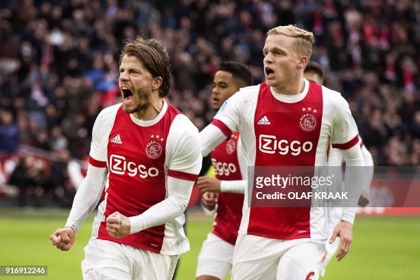 Ajax Amsterdam's Danish midfielder Lasse Schone reacts with temmate, midfielder Donny van de Beek after scoring his team's second goal during the...