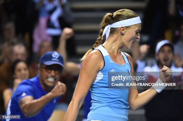 France's Kristina Mladenovic reacts in front of France's captain Yannick Noah after a point to Belgium's Elise Mertens during the Tennis Fed Cup...