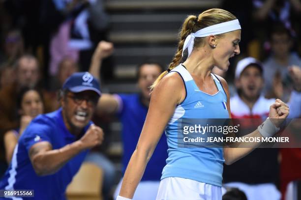 France's Kristina Mladenovic reacts in front of France's captain Yannick Noah after a point to Belgium's Elise Mertens during the Tennis Fed Cup...