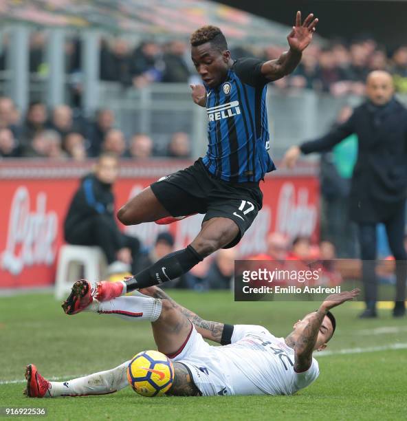 Yann Karamoh of FC Internazionale Milano is challenged by Erick Pulgar of Bologna FC during the serie A match between FC Internazionale and Bologna...