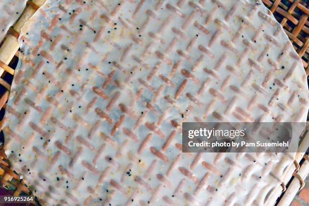 close-up, sesame rice paper crepe candy drying - crepe paper stock pictures, royalty-free photos & images