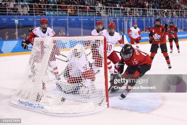 Melodie Daoust of Canada scores a goal against Nadezhda Morozova of Olympic Athlete from Russia in the third period during the Women's Ice Hockey...