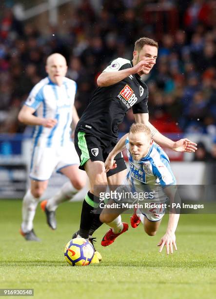 Huddersfield Town's Alex Pritchard battles for the ball during the Premier League match at the John Smith's Stadium, Huddersfield.