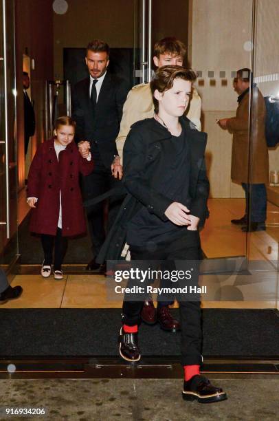 David Beckham, Cruz Beckham, Harper Beckham, Romeo Beckham are seen leaving a hotel in midtown on February 11, 2018 in New York City.