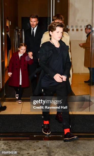 David Beckham, Cruz Beckham, Harper Beckham, Romeo Beckham are seen leaving a hotel in midtown on February 11, 2018 in New York City.