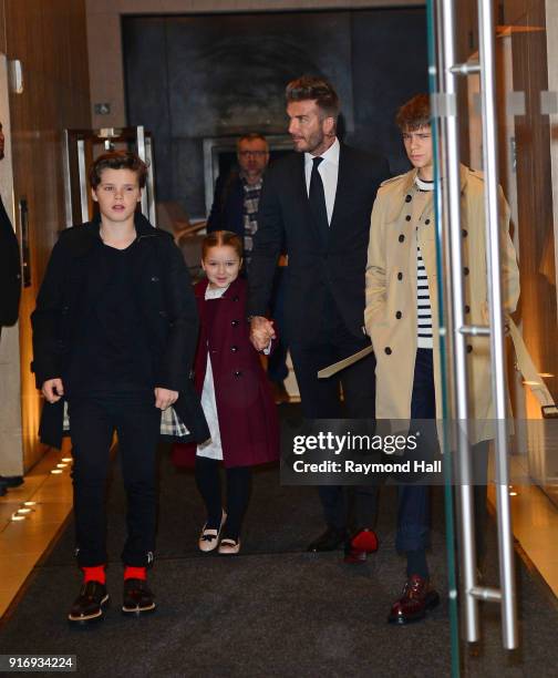 David Beckham, Cruz Beckham, Harper Beckham, Romeo Beckham are seen leaving a hotel in midtown on February 11, 2018 in New York City.