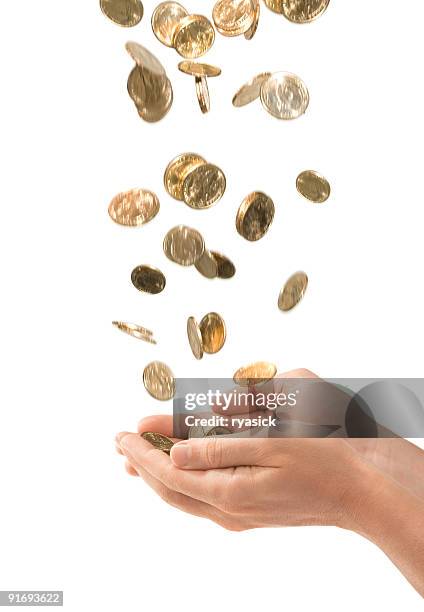 male cupped hands catching falling gold coins isolated on white - coins stockfoto's en -beelden