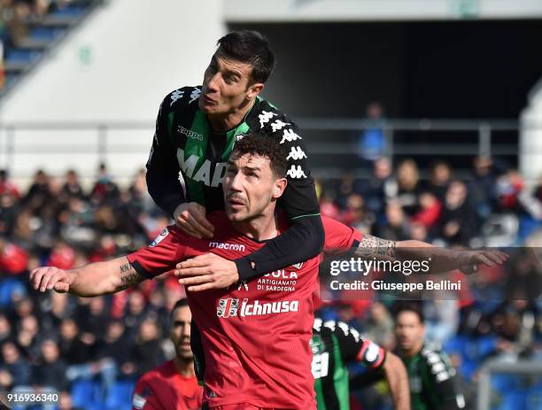 Artur Ionita of Cagliari Calcio and Federico Peluso of US Sassuolo in action during the serie A match between US Sassuolo and Cagliari Calcio at...