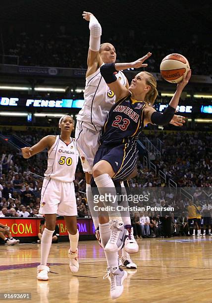 Katie Douglas of the Indiana Fever attempts a shot under pressure from Diana Taurasi of the Phoenix Mercury in Game Five of the 2009 WNBA Finals at...