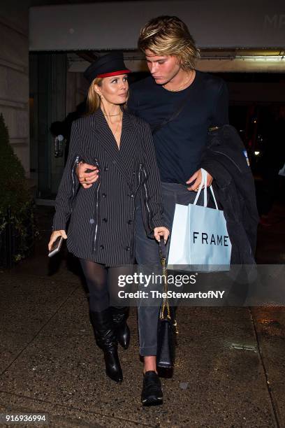 Elizabeth Sulcer and Jordan Barrett is seen in Midtown on February 10, 2018 in New York City.