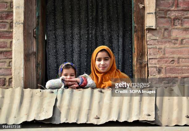 Kashmiri girls pose for a photograph during shutdown in Srinagar, Indian administered Kashmir. Curfew-like restrictions have been imposed in parts of...