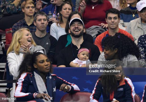 Serena Williams of Team USA, bottom left, along with her husband Alexis Ohanian and their daughter Alexis Olympia, center, watch the action during...