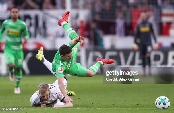 Thorgan Hazard of Moenchengladbach is challenged by Timo Baumgartl of Stuttgart during the Bundesliga match between VfB Stuttgart and Borussia...