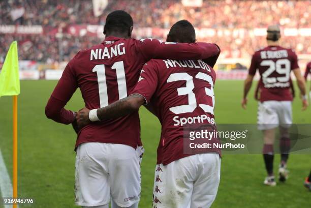 Nicolas Nkoulou celebrates after scoring with M'Baye Niang during the Serie A football match between Torino FC and Udinese Calcio at Olympic Grande...