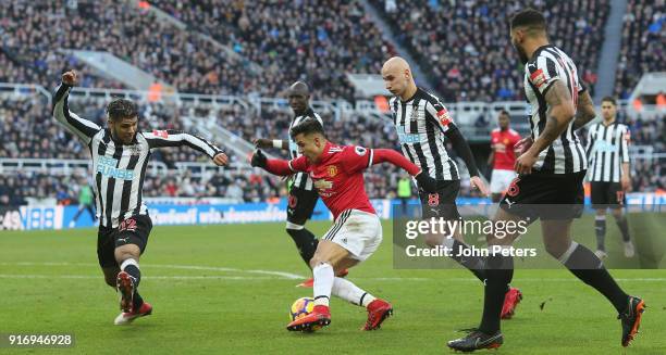 Alexis Sanchez of Manchester United in action with Deandre Yedlin, Mohamed Diame, Jonjo Shelvey and Jamaal Lascelles of Newcastle United during the...