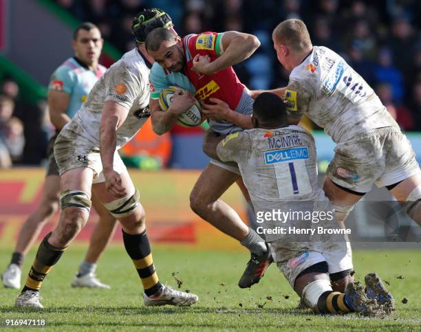 Joe Marchant of Harlequins tackled by James Gaskell , Jack Willis and Simon McIntyre of Wasps during the Aviva Premiership match between Harlequins...