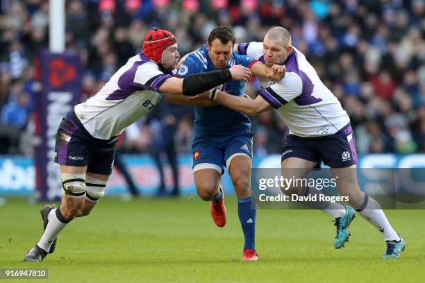 Lionel Beauxis of France is tackled by Grant Gilchrist of Scotland and Gordon Reid of Scotland during the NatWest Six Nations match between Scotland...