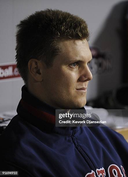 Pitcher Jonathan Papelbon of the Boston Red Sox watches the Los Angeles Angels of Anaheim celebrate their 4-1 win from the dugout during the ALDS in...