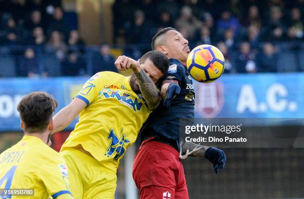 Alessandro Gamberini of Chievo Verona competes with Gianluca Lapadula of Genoa during the serie A match between AC Chievo Verona and Genoa CFC at...