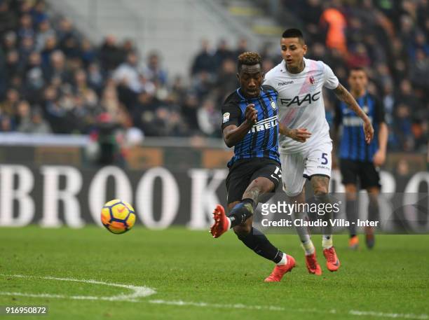 Yann Karamoh of FC Internazionale competes for the ball with Erick Pulgar of Bologna FC during the serie A match between FC Internazionale and...