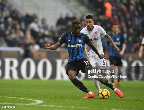 Yann Karamoh of FC Internazionale competes for the ball with Erick Pulgar of Bologna FC during the serie A match between FC Internazionale and...