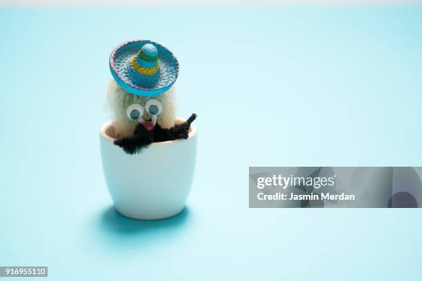 cactus on the desk with pastel blue wall background - bosnia herzegovina v mexico stock pictures, royalty-free photos & images