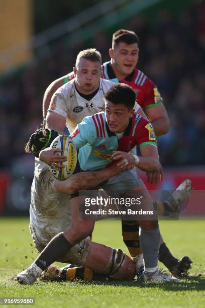 Marcus Smith of Harlequins is tackled by James Gaskell of Wasps during the Aviva Premiership match between Harlequins and Wasps at Twickenham Stoop...