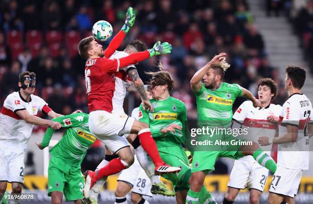 Goalkeeper Ron-Robert Zieler and Daniel Ginczek of Stuttgart battle for the ball with Jannik Vestergaard and Raul Bobadilla of Moenchengladbach...