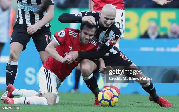 Juan Mata of Manchester United in action with Jonjo Shelvey of Newcastle United during the Premier League match between Newcastle United and...