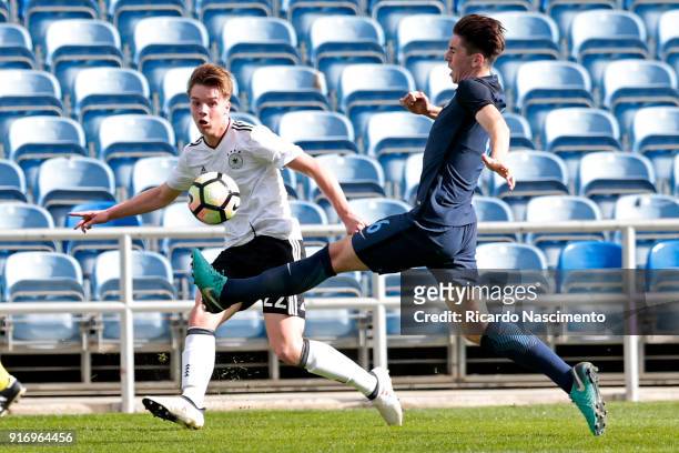 Lenny Borges of Germany U17 chalenges Luis Binks of England U17 during U17-Juniors Algarve Cup match between U17 Germany and U17 England at Algarve...